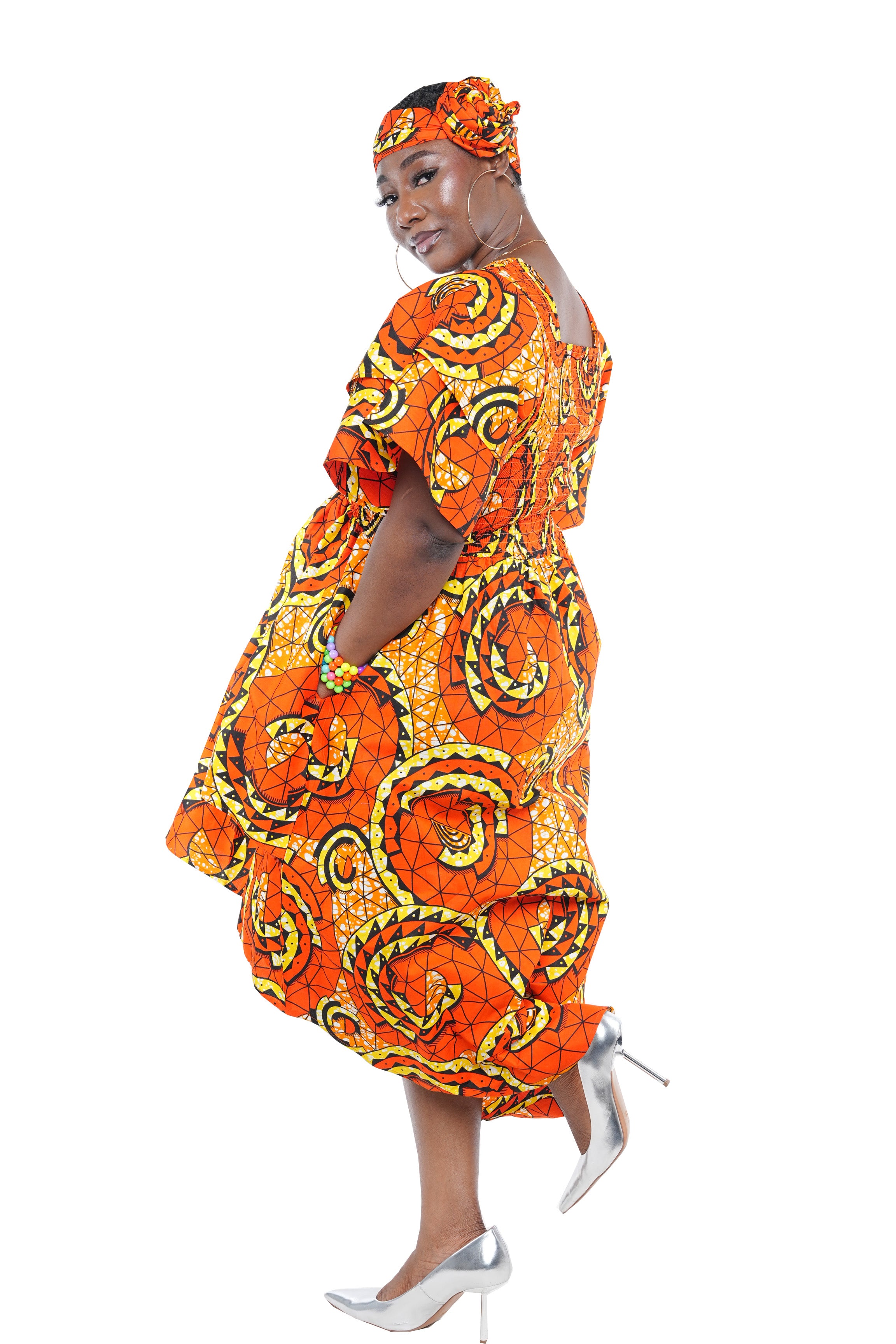 African smocked high low dress with headwrap and pockets
Afrocentric cotton dress with double layer hem and V neckline
High low African dress one size fits most
African dresses for women