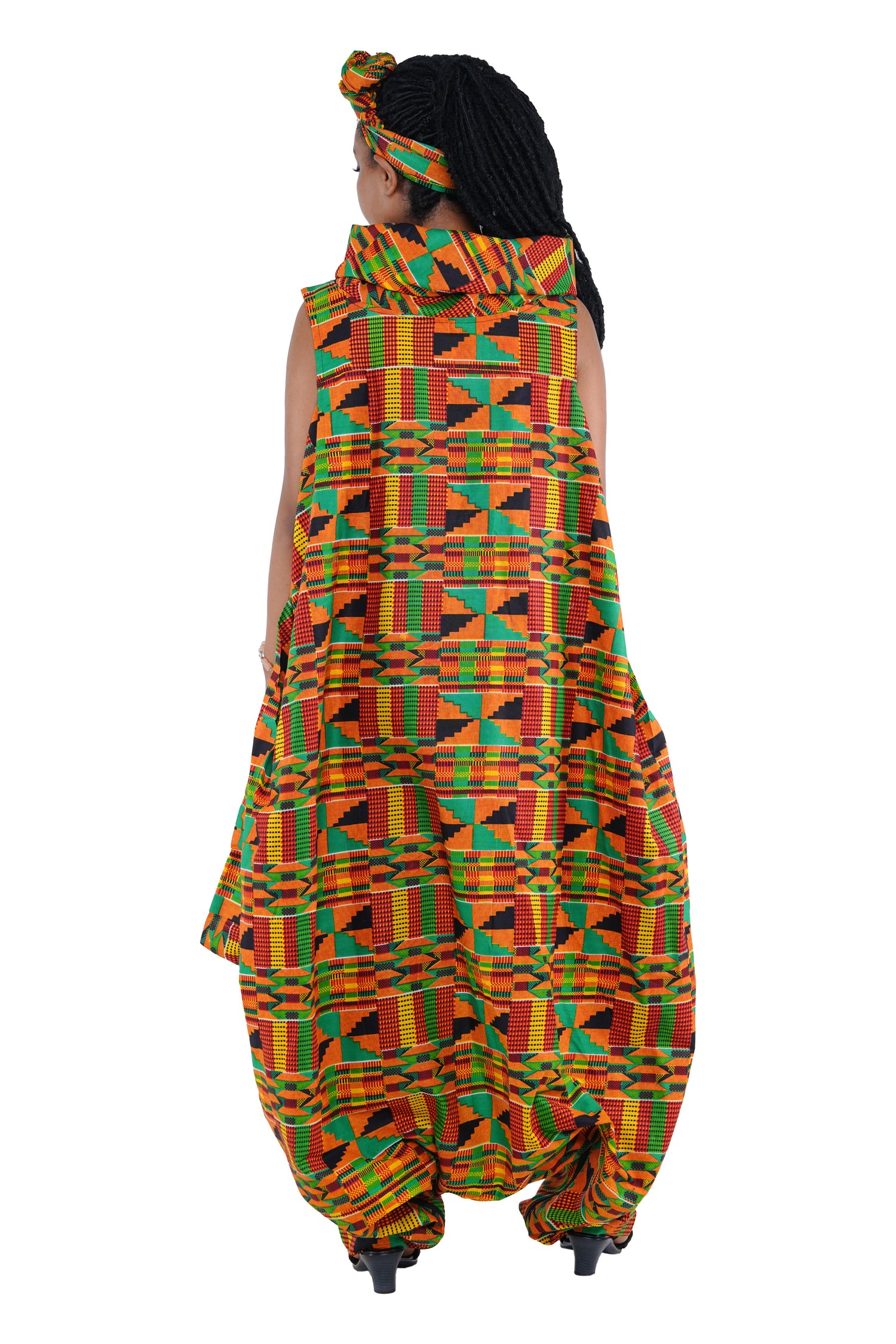 Elegant African woman wearing long high neck jumpsuit with matching headwrap in traditional print – 100% cotton, includes side pockets.