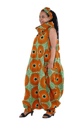 Elegant African woman wearing long high neck jumpsuit with matching headwrap in traditional print – 100% cotton, includes side pockets.