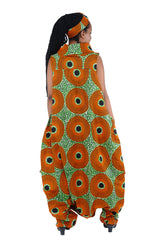 Elegant African woman wearing long high neck jumpsuit with matching headwrap in traditional print – 100% cotton, includes side pockets.