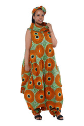 Elegant African woman wearing long high neck jumpsuit with matching headwrap in traditional print – 100% cotton, includes side pockets.