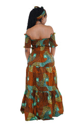 “Back view of smocked bodice off shoulder African print dress”