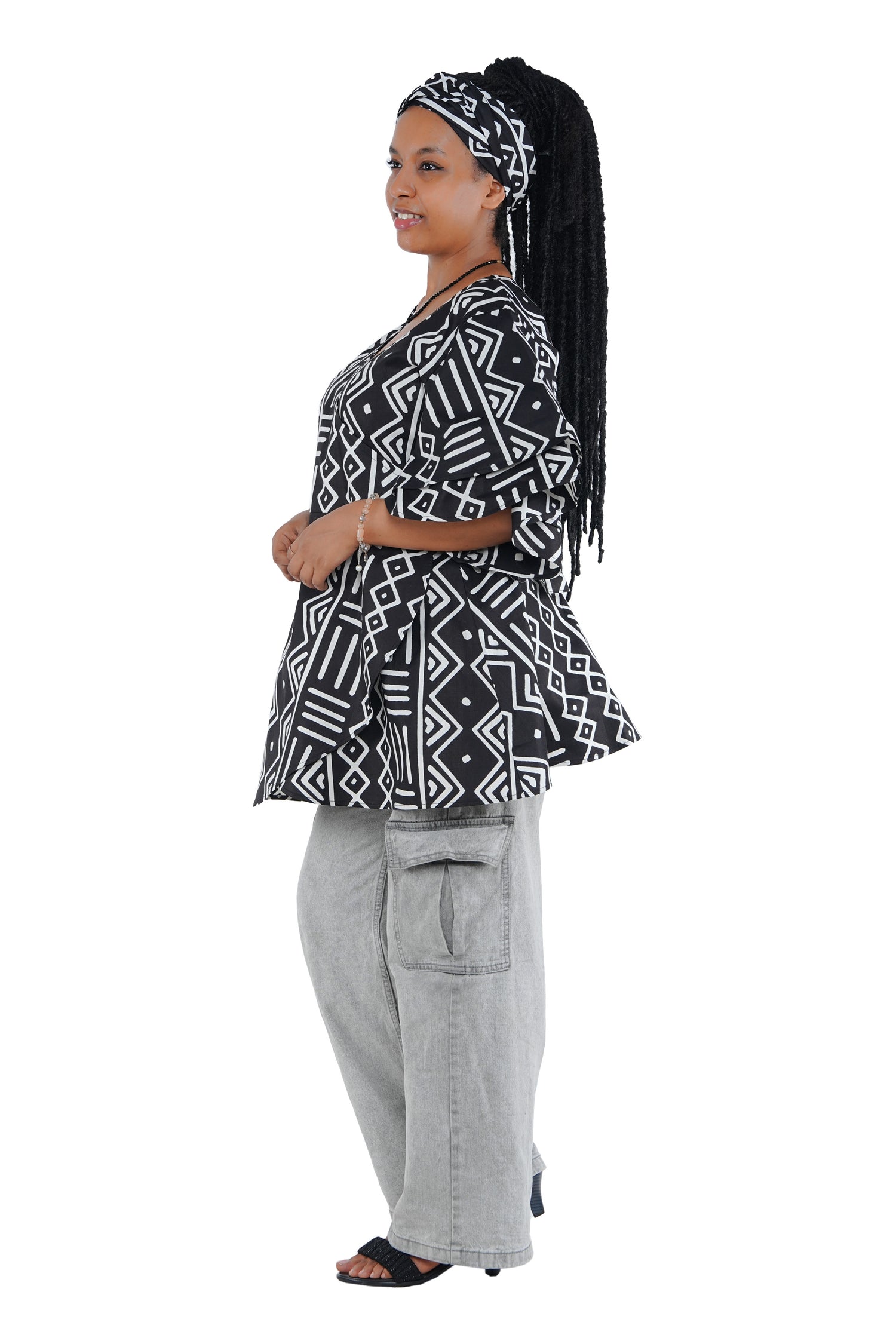 Woman wearing African print wrap top with 3/4 sleeves double layered – cotton, one size,  – Ankara inspired