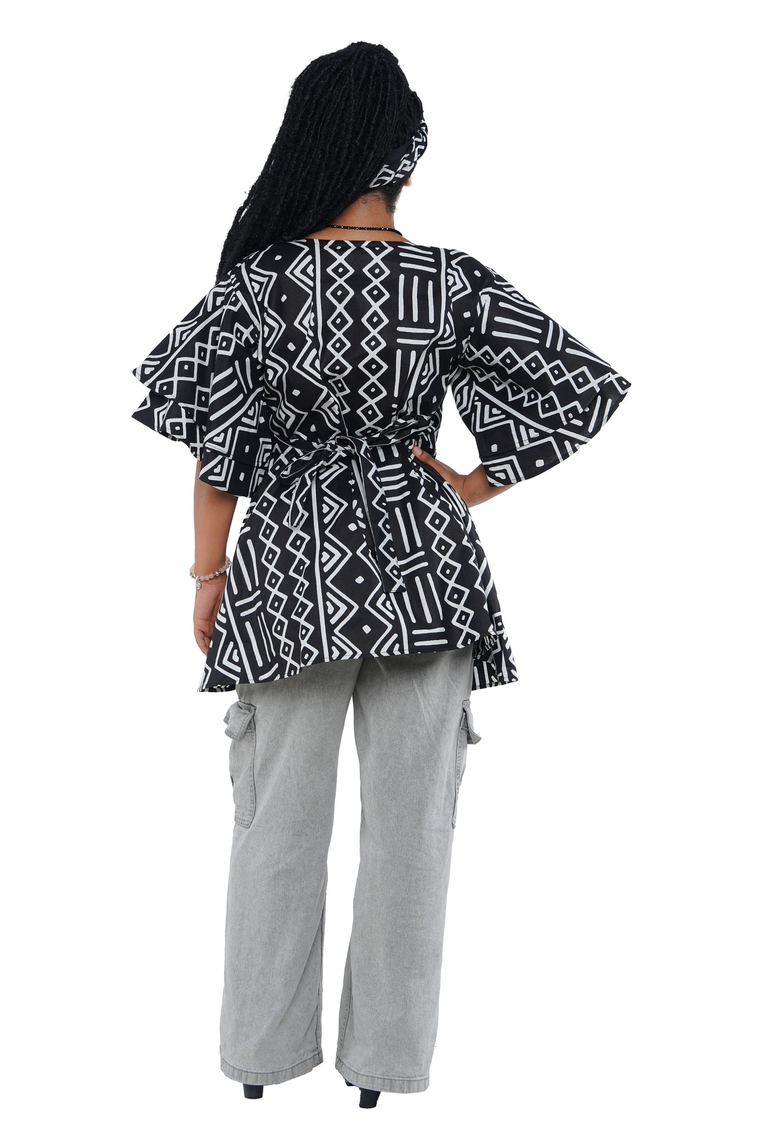 Woman wearing African print wrap top with 3/4 sleeves double layered – cotton, one size,  – Ankara inspired