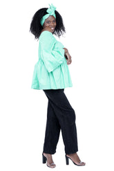 Side profile of African peplum blouse with flared hem and smocked waist