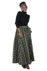 Woman wearing African print long maxi skirt in bold Ankara fabric, styled for cultural events, weddings, or everyday elegance.