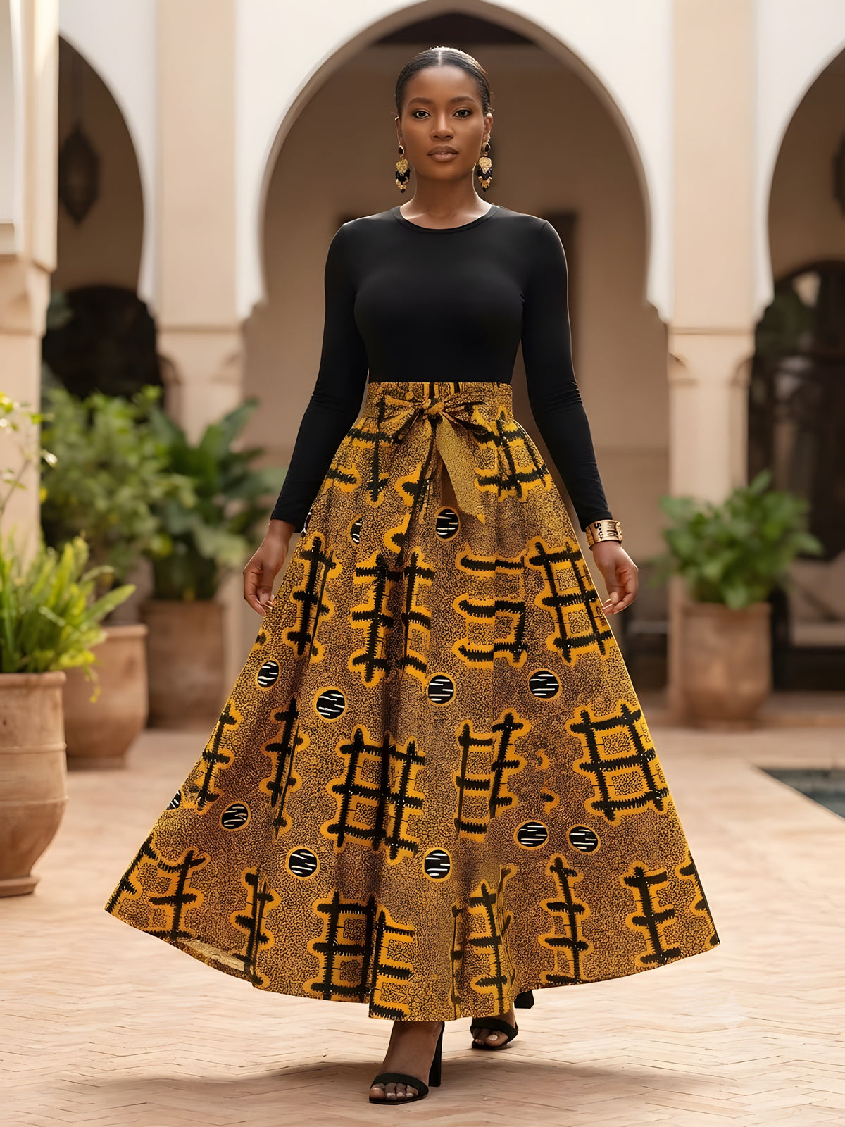 Close-up of elasticated waistband and attached pair of belts on African print cotton maxi skirt