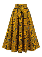 Model wearing African print maxi skirt with matching headwrap styled with a coordinating top