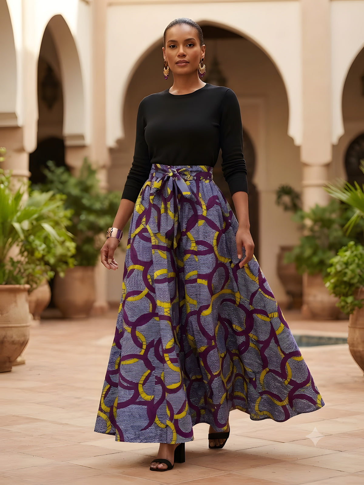 Model wearing African print maxi skirt with matching headwrap styled with a coordinating top