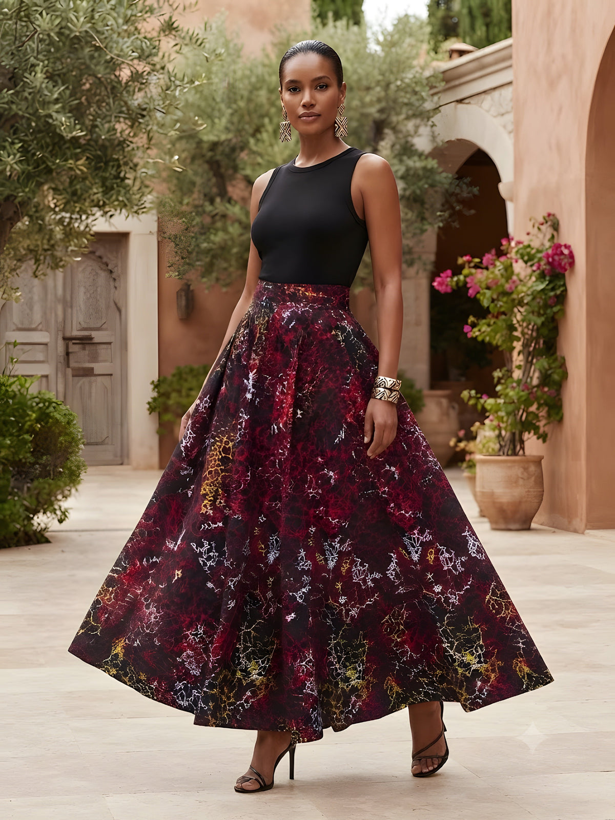 Model wearing African print maxi skirt with matching headwrap styled with a coordinating top