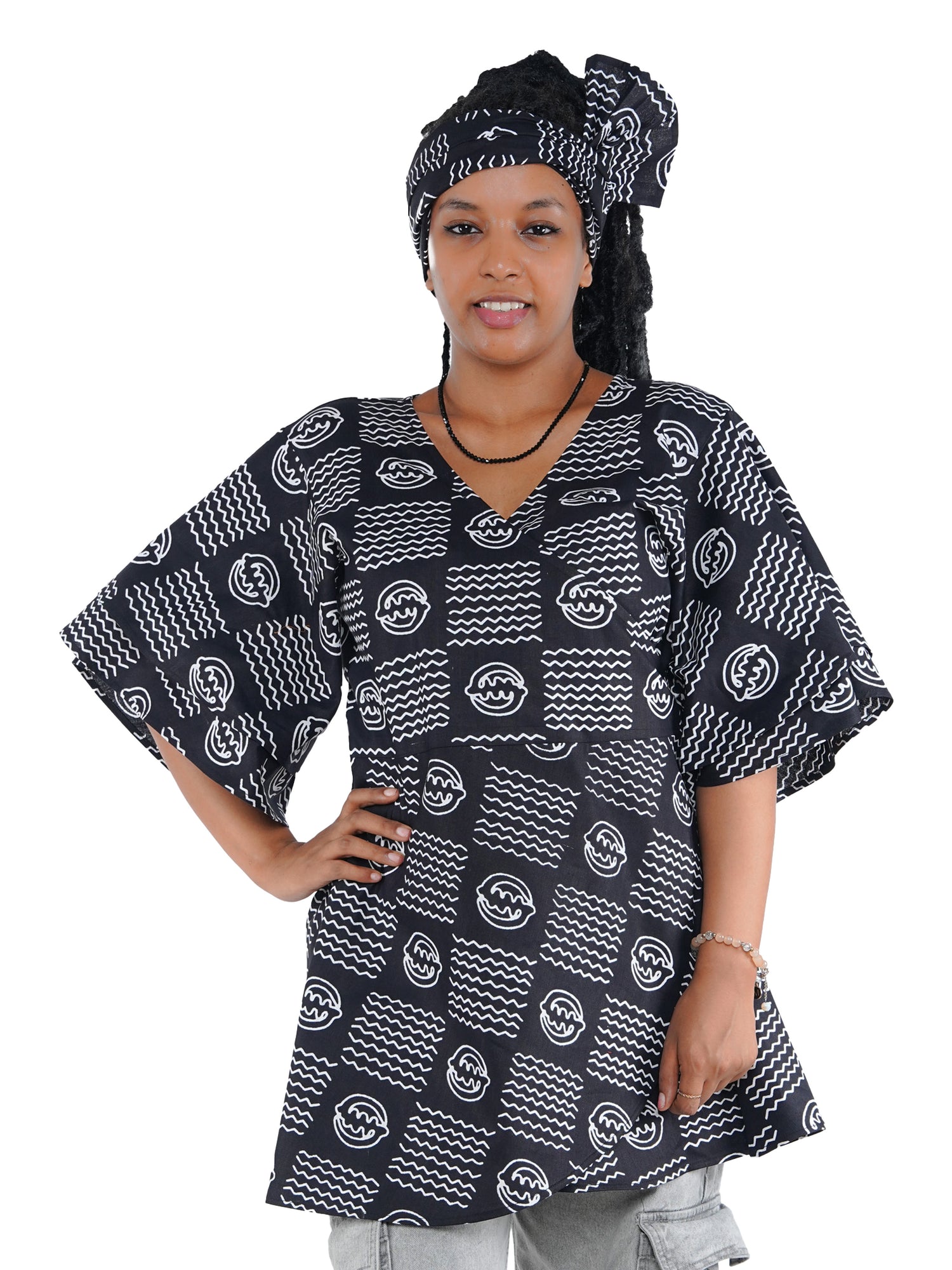 Woman wearing African print wrap top with 3/4 sleeves double layered – cotton, one size,  – Ankara inspired