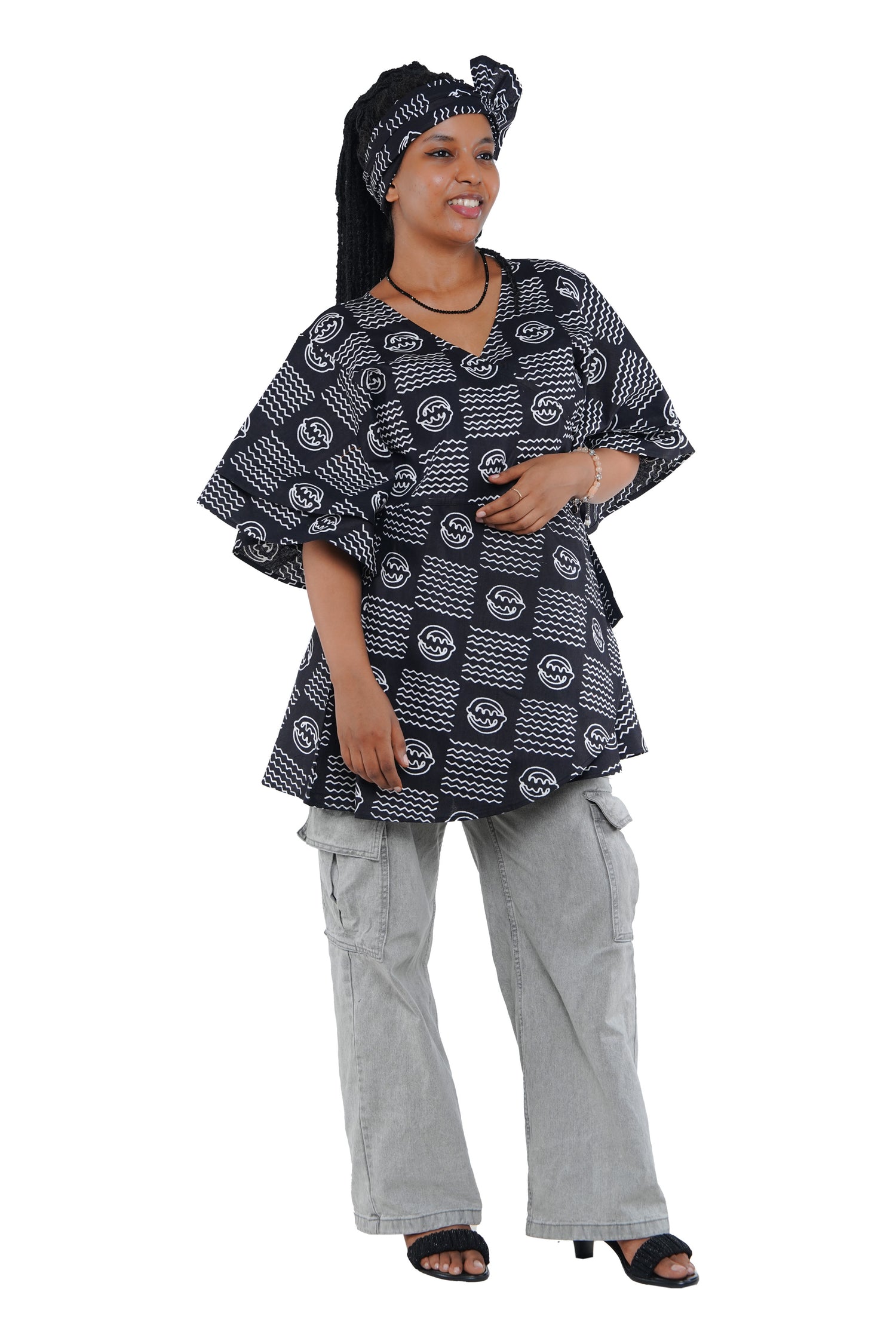 Woman wearing African print wrap top with 3/4 sleeves double layered – cotton, one size,  – Ankara inspired