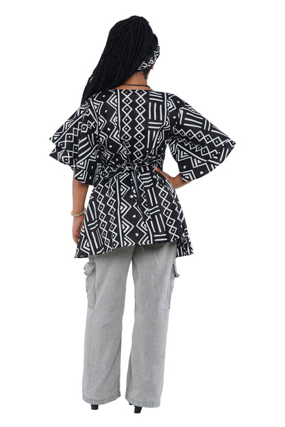 Woman wearing African print wrap top with 3/4 sleeves double layered – cotton, one size,  – Ankara inspired